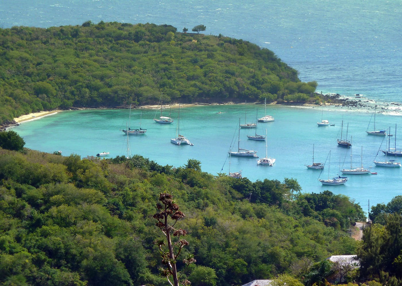 A small green island offshore from Antigua’s coast