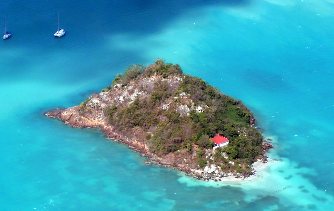 Shallow turquoise water over a sandbar off Antigua’s north-east coast